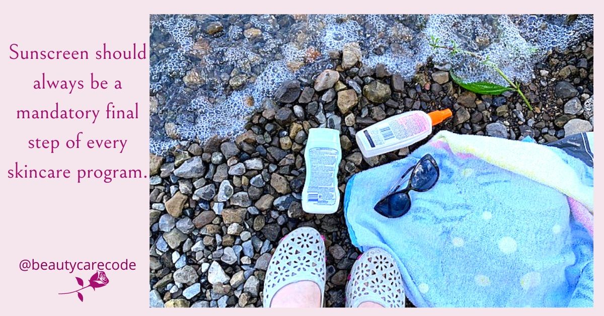 Image of seashore with a pair of sandal, sunglasses, 2 bottles of sunscreen and a towel for top tips for healthier skin