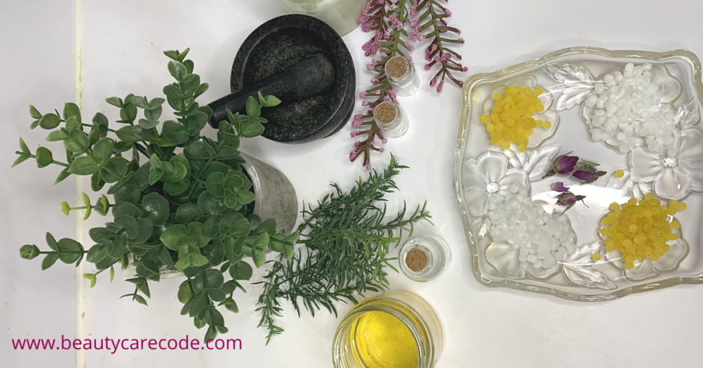 An image of a some skincare ingredients with some herbs and a mortar and pestle in a white background